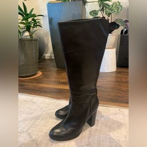 Knee high leather boots.